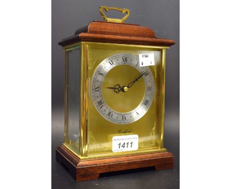 A 20th century mahogany and lacquered brass mantel clock, 10.5cm dial inscribed Woodford, silvered chapter ring with Roman nu