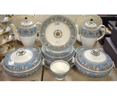 A Wedgwood blue Florentine pattern part dinner service, comprising a pair of vegetable dishes and covers, a bread and butter 