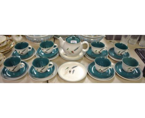 A Denby Greenwheat ceramics teapot, eight cups, ten saucers, eleven side plates 