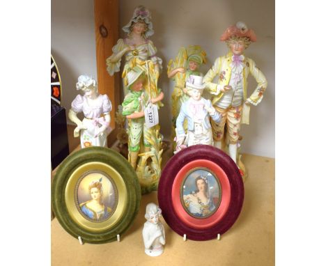 A pair of continental porcelain figures, a lady and her beau, in 18th century dress; others similar; a pair of decorative ova