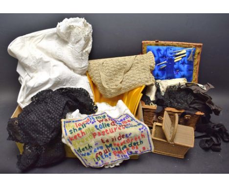 Textiles - a wicker sewing basket, a bone crochet hook, a white cotton dressing gown, a miniature wicker sewing basket as a h