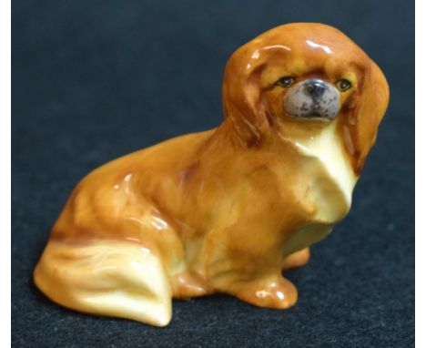 A Royal Worcester animal model,  of a Pekingnese dog, printed crown and circle mark in black, model no. 3034