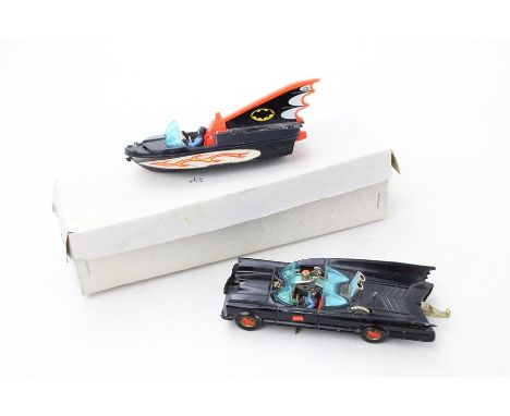 Vintage Corgi batmobile and batboat toy models with red hubs and tow bar items are in vintage used condition