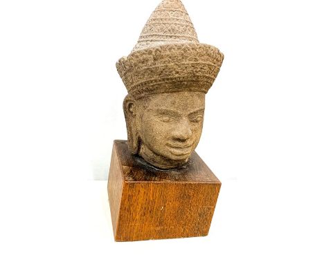 Cambodian stone head mounted on wood plinth 