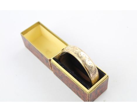 Vintage 9ct rolled gold bangle with engraved design in antique box Internal diameter of approx 6.5cmwidth of 1.6cm safety cha