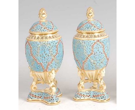 A pair of Grainger &amp; Co Royal Chinaworks Worcester reticulated vases and covers, each decorated in powder-blue with turqu