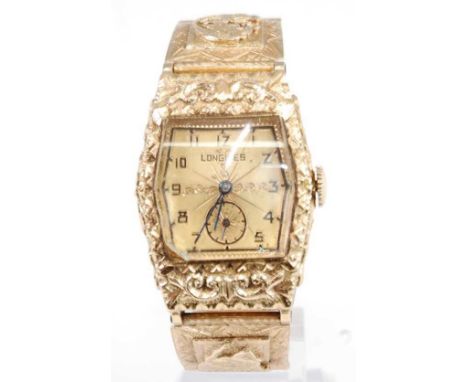 A Gents yellow metal Longines manual wind wristwatch, having tonneau shaped gilt champagne Arabic dial and sub-dial at 6 o'cl