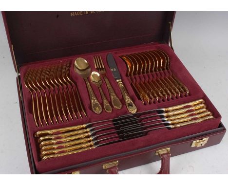 A modern Solingen 12-place setting gilt plated on steel cutlery suite, to include table knives, table forks, dessert spoons, 