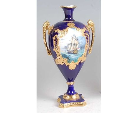 A Lynton Porcelain Co pedestal twin handled vase, of slender baluster form, polychrome enamel decorated with a reserve of a t