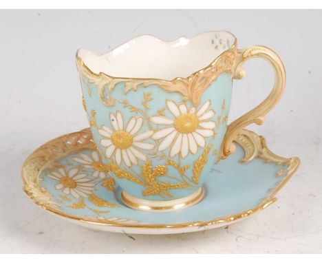 A Royal Worcester porcelain Empress teacup and saucer, shot enamel decorated with flowers and foliage, puce mark, shape No.14