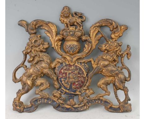 A Victorian cast iron architectural Royal Coat of Arms, cast in relief with the crowned English lion and Scottish unicorn sup