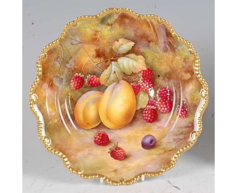 A Royal Worcester porcelain cabinet plate, decorated by Horace Price with fruit on a mossy bank, within a gilt border, signed