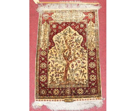 A Turkish silk Hereke Tree of Life prayer mat, having Kilim flatweave single end, with border verse panels and signed, 78 x 5