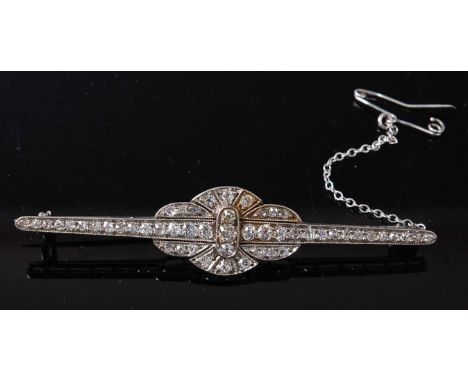 An Art Deco white metal diamond lozenge shaped bar brooch, comprising 51 graduated Old European and rose cut diamonds in grai