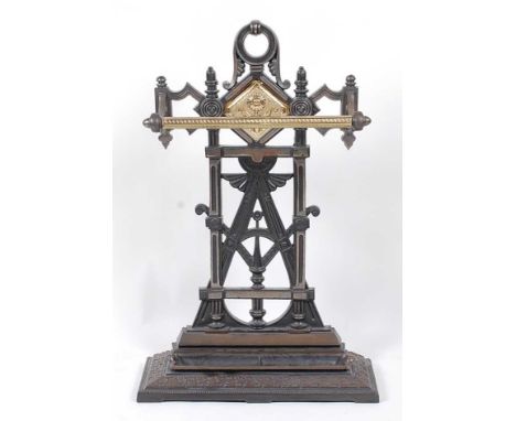 An Edwardian cast iron and brass stick-stand, w.47cm, h.73cm