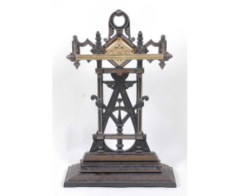 An Edwardian cast iron and brass stick-stand, w.47cm, h.73cm