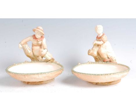 A pair of Hadley Worcester Queen Anne boy and girl comports, being numbers 1 and 4, each embellished in bright enamels and he
