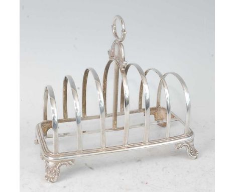 A William IV silver six-division toast rack, raised on scroll cast feet, 8oz, maker Henry Wilkinson &amp; Co, Sheffield 1836,