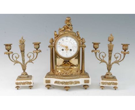 A French gilt brass and marble three-piece clock garniture, the clock having an unsigned convex white enamel dial with twin w