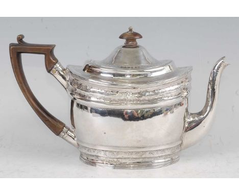 A George III silver teapot, having a finial topped hinged dome cover, bright cut engraved banded decoration to the frieze and