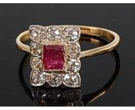 A yellow metal, ruby and diamond rectangular cluster ring, comprising a centre step cut ruby within a border of ten Old Europ