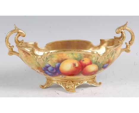 A Royal Worcester twin handled footed bowl, decorated with fruit on a mossy bank by Horace Price, signed, the reverse with a 