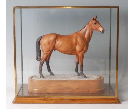 A Royal Worcester model of Arkle, modelled by Doris Lindner, model No.34, h.22cm (excluding plinth), in glazed display case a