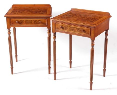 A pair of Regency style burr walnut, oak crossbanded, and feather strung lamp tables, each having a raised back above a singl