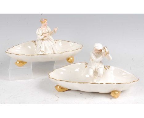 A pair of mid-Victorian Worcester porcelain sweetmeat dishes, of shell shape, each centred with a male and female musician, h