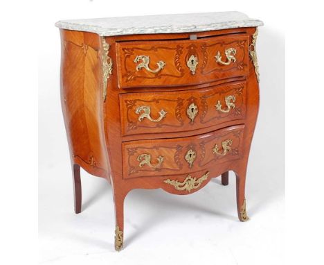 A French kingwood and marquetry inlaid bombe commode, in the Louis XV style, having a marble top and gilt brass mounts, w.79c