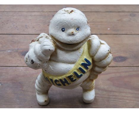 VINTAGE PAINTED CAST IRON MICHELIN MAN- REG 67548 DETROIT, APPROXIMATELY 15cm HIGH 