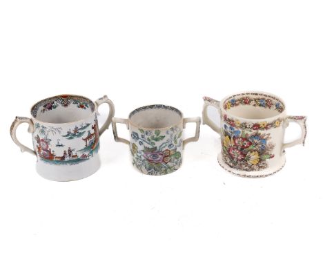 Three twin handled cider mugs. Comprising a Wade Potteries example decorated with flowers, a Cork & Edge 'Peru' mug and one o