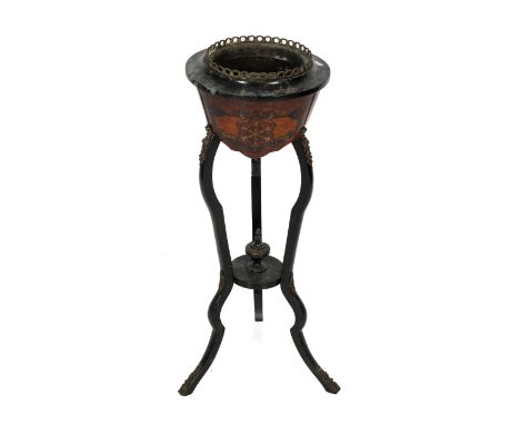 A Victorian inlaid jardiniere plant stand. Having pierced metalwork gallery raised on three supports united by a disc with a 