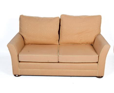 A S. Rouse & Co. two seater upholstered sofa. Upholstered in pink and white fabric, on bun feet. H86cm x W167cm x D86cm