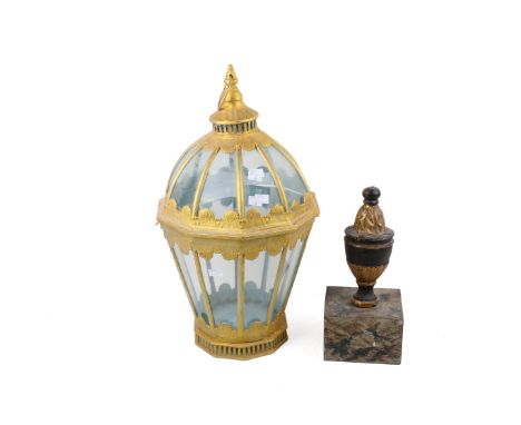 A solid cast metal finial and a painted lantern. Finial mounted on a metal plinth. Max. H56cm