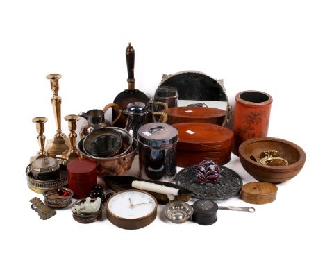 Two wicker baskets of assorted metalware. Including a set of four copper jelly moulds, candlesticks, a clip modelled as a cor