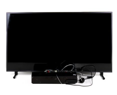 A Samsung 'The Frame' smart TV. Model QE43LS03RAU, with the remote and One Connect box. Model SOC1001R. H60cm