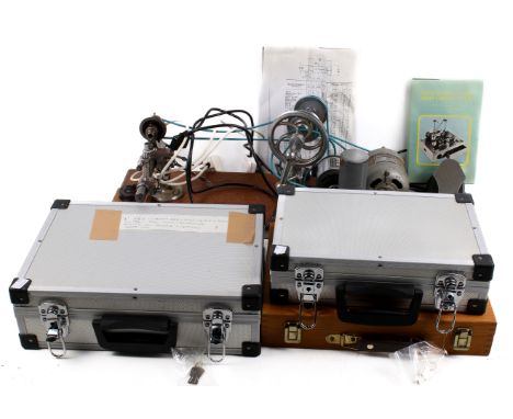 A comprehensive watch or model engineer's lathe and accessories. Including chucks, cross slide and tool holder, etc. H26cm