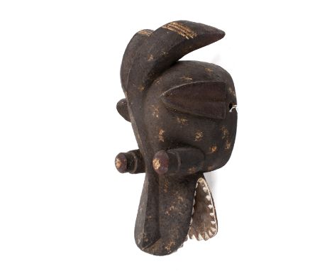 A West African tribal carved wood Suaga type mask. With traces of red, white pigment. Possibly Mambila people Cameroon / Nige