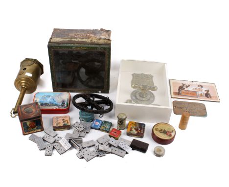 An assortment of collectables. Including vintage advertising tins, a set of Franklyn's Fine Shag dominoes, brass safe fitting