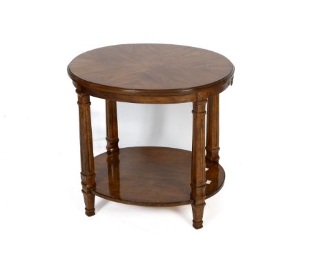 A Drexel Heritage oak side table. The oval top mounted on square supports united by a shelf. H61cm x W65cm x D55cm