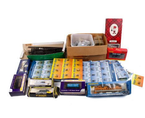 An assortment of 00 gauge freight stock and accessories. Including a Hornby 6 Wheel Milk Tank, 6377, R.6406, lengths of track