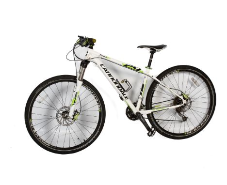 A Cannondale 'Trail 4' 29 mountain bike. Having a white, black and green frame, H107cm Condition Report: Appears to be functi