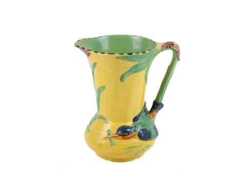 A Burleigh pottery jug. Decorated with a bird and foliage on a yellow ground, H26cm