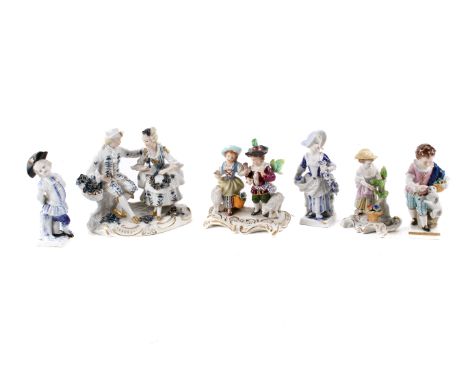 Six Sitzendorf German porcelain figures. Including a figure group of a shepherd and shepherdess, a boy with a dog and more. M