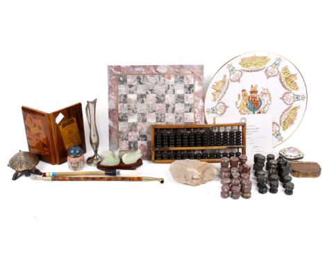 A group of assorted collectables. Including a carved stone chess set, enamel boxes, a fossil tooth, etc.