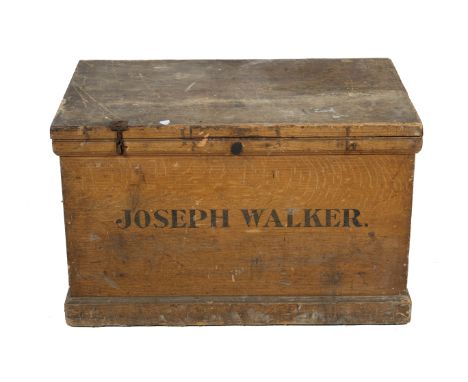 A large pine travel trunk box 'Joseph Walker'. Stencilled name to the front, heavy iron handle at each end. H92cm x W99cm x D