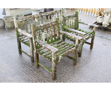 A three piece garden furniture set. Comprising one bench and two chairs, all with vertical slats and horizontal seat, bench H