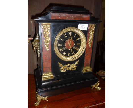 Victorian marble mantle clock by Maple &amp; Co with ormolu mounts and black dial and gilt Roman numerals, the movement strik