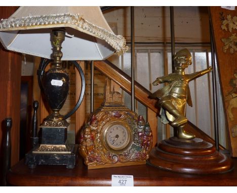 Ormolu and marble table lamp, an Oriental brass dancing man and a German kitsch metal clock adorned with gnomes